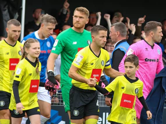 Harrogate Town players take the field ahead of Saturday's opening-day victory over Rochdale at the EnviroVent Stadium. Pictures: Matt Kirkham