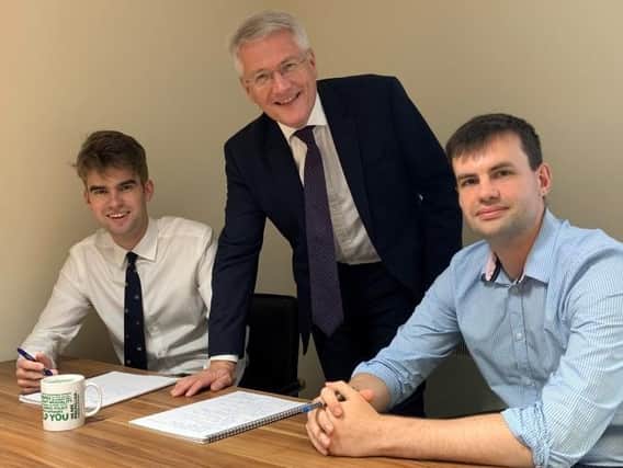 Supporting Harrogate District Foodbank - Andrew Jones MP with caseworkers Stephen Culpin (left) and Matt Scott.
