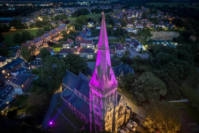 Knaresborough Trinity Church spire lit up for FEVA. Drone picture by Richard Maude.