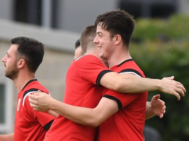 Hat-trick hero Sean Hunter is congratulated after finding the net during Knaresborough Town's 4-0 rout of Hemsworth. Pictures: Gerard Binks