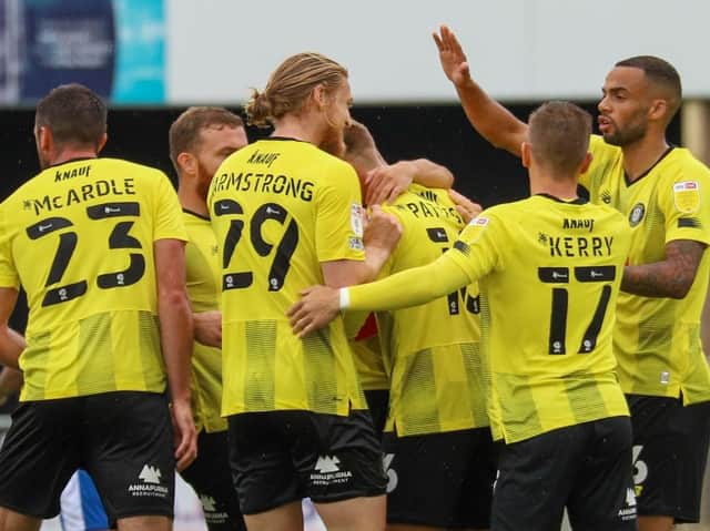 Harrogate Town players celebrate Alex Pattison's 60th-minute equaliser against Barrow. Pictures: Matt Kirkham