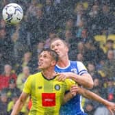 Danilo Orsi looks to escape the attentions of Barrow defender Mark Ellis. Pictures: Matt Kirkham