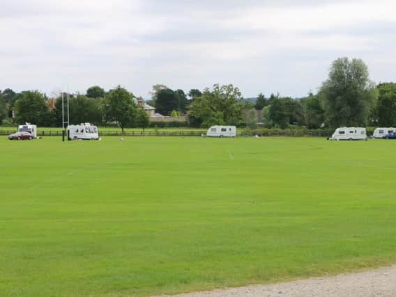 The group of travellers with cars and caravans at the school on Yew Tree Lane in Harrogate pictured on Tuesday night.