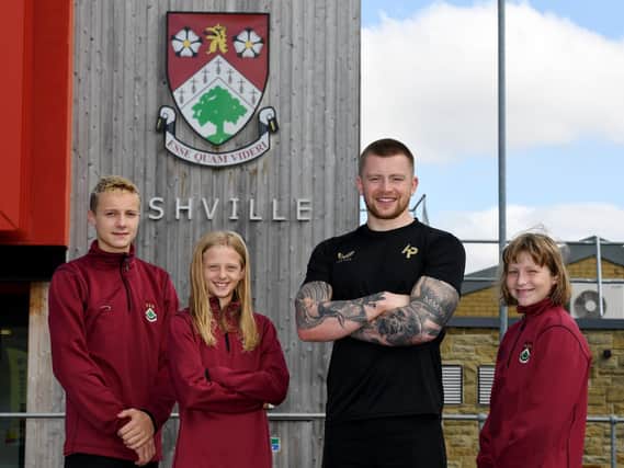 Olympic medal hero Adam Peaty meets up with young swimmers at Ashville College.
