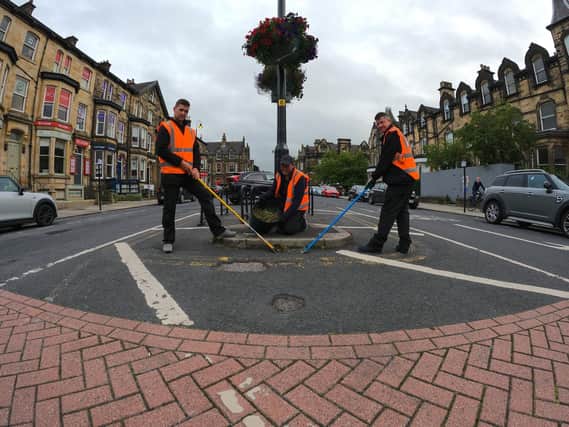 Harrogate BID team's hard at work tidying things in the town centre.