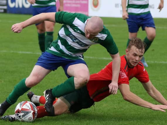 Joe Navier goes to ground under pressure from an opponent during Harrogate Railway’s NCEL Division One victory over Glasshoughton Welfare. Picture: Craig Dinsdale