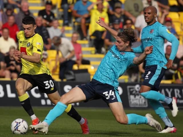 Harrogate Town substitute Simon Power runs at the Exeter City defence. Pictures: Harrogate Town AFC
