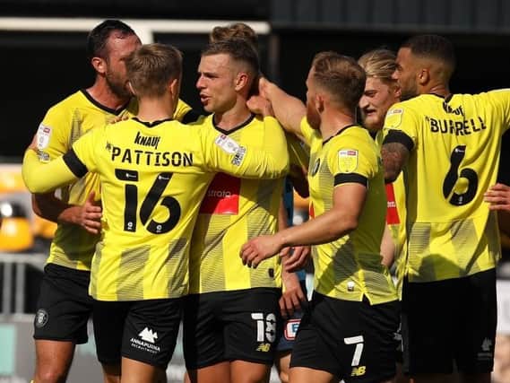 Harrogate Town players celebrate Jack Muldoon's first-half opener against Exeter City. Pictures: Harrogate Town AFC