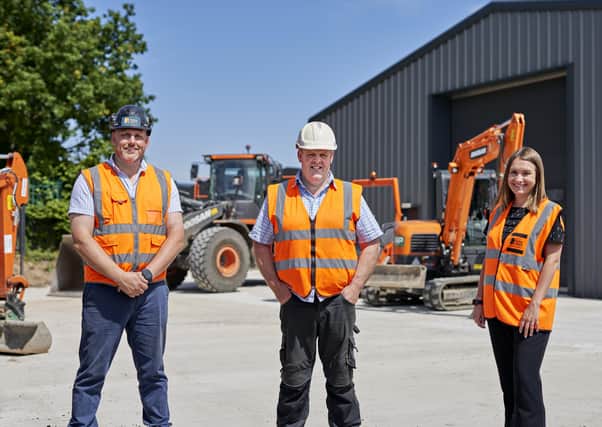 Construction manager John Royle and Jenna Strover, head of commercial delivery at Potter Space, with (middle) Matthew Robinson of Unit 24 customer Recycled Asphalt Products (RAP). PHOTO: Adrian Ray Photography Ltd.