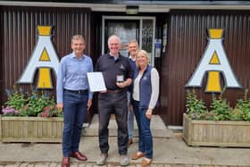 Chris I'Anson, Steve Kilding, Will I'Anson and Sarah Richardson celebrate Mr Kilding's long service award for having worked for the company for 25 years.