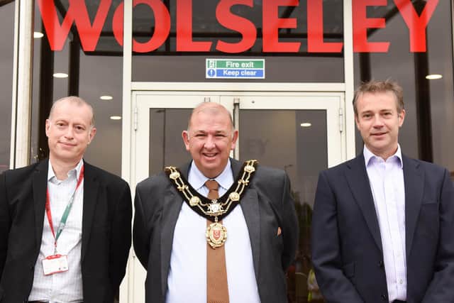 The Mayor of Ripon, Coun Eamon Parkin, is flanked by Wolseley UK's finance director Mark Stibbards (left) and CEO Simon Oakland as they officially re-open the company's head office and support centre following a major refurbishment. PHOTO: Sara Porter.