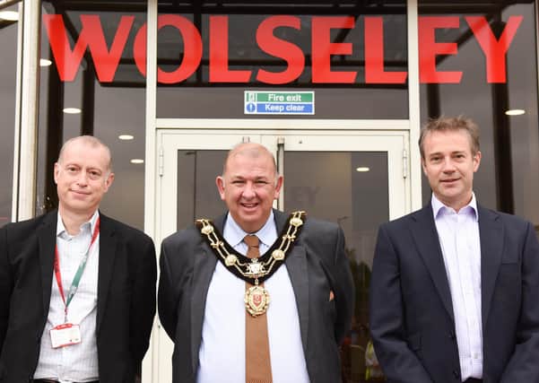The Mayor of Ripon, Coun Eamon Parkin, is flanked by Wolseley UK's finance director Mark Stibbards (left) and CEO Simon Oakland as they officially re-open the company's head office and support centre following a major refurbishment. PHOTO: Sara Porter.