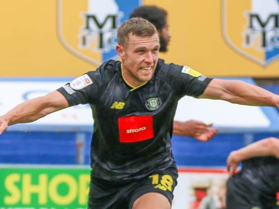 Jack Muldoon celebrates after putting Harrogate Town 2-1 up against Mansfield Town on the stroke of half-time. Pictures: Matt Kirkham