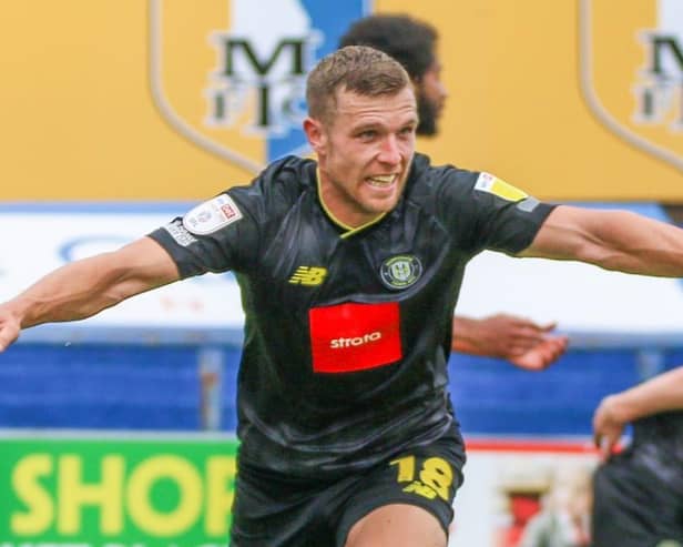 Jack Muldoon celebrates after putting Harrogate Town 2-1 up against Mansfield Town on the stroke of half-time. Pictures: Matt Kirkham