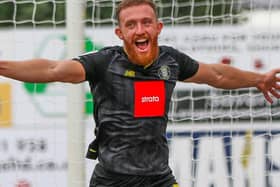 George Thomson celebrates after putting Harrogate Town 3-1 up at Mansfield. Pictures: Matt Kirkham