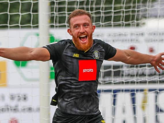 George Thomson celebrates after putting Harrogate Town 3-1 up at Mansfield. Pictures: Matt Kirkham