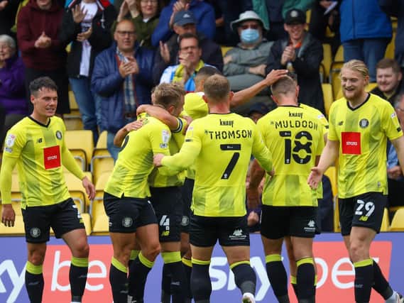 Harrogate Town players celebrate in front of their supporters at the EnviroVent Stadium. Pictures: Matt Kirkham