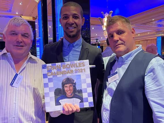 Dave Rowson (right) with ex Leeds United player Jermaine Beckford - one of the many famous faces to have had their photo taken with the Stan Bowles calendar