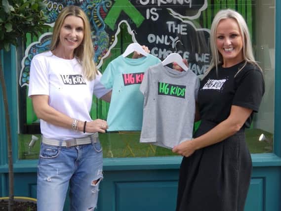 Georgie Simpson (left) and Anna Lockwood (right), owners of Tiger Fifty 7 with their range of HG Kids t-shirts which they are selling to raise money for Wellspring Therapy and Training