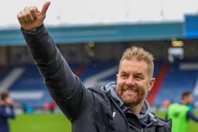 Simon Weaver acknowledges Harrogate Town's travelling support following Saturday's 2-1 win at Oldham Athletic. Pictures: Matt Kirkham