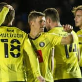 Harrogate Town celebrate after Lloyd Kerry, centre, fired them into an early lead against Newcastle United U21s. Pictures: Matt Kirkham