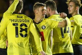 Harrogate Town celebrate after Lloyd Kerry, centre, fired them into an early lead against Newcastle United U21s. Pictures: Matt Kirkham