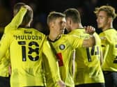 Harrogate Town celebrate after Lloyd Kerry, centre, fired them into an early lead against Newcastle United U21s. Pictures: Matt Kirkham
