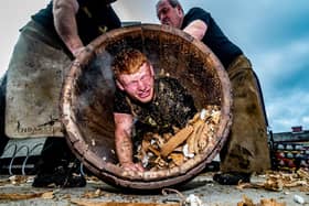 Euan Findlay in a barrel during the trussing in ceremony at Theakston Brewery.  Picture James Hardisty