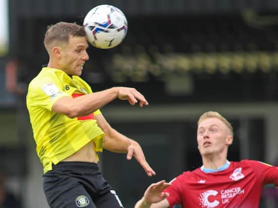 Jack Muldoon heads Harrogate Town into an eighth-minute lead against Scunthorpe United. Pictures: Matt Kirkham