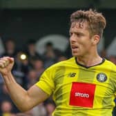 Danilo Orsi celebrates after scoring from the penalty spot during Harrogate Town's 6-1 success over Scunthorpe United. Pictures: Matt Kirkham