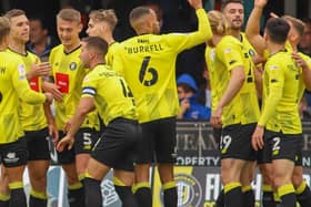 Harrogate Town's players celebrate taking an early lead against Scunthorpe United. Picture: Matt Kirkham