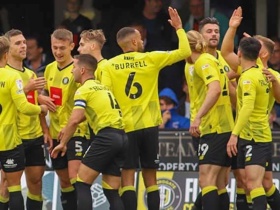 Harrogate Town's players celebrate taking an early lead against Scunthorpe United. Picture: Matt Kirkham