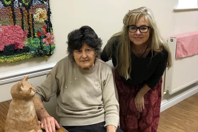 Vision Support Harrogate District's ceramics tutor Kay Latto (right) with Pat Dawson and her sculpture entitled 'Clawed' (left)