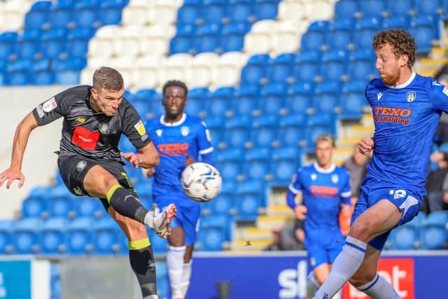 Jack Muldoon takes aim at the Colchester goal.