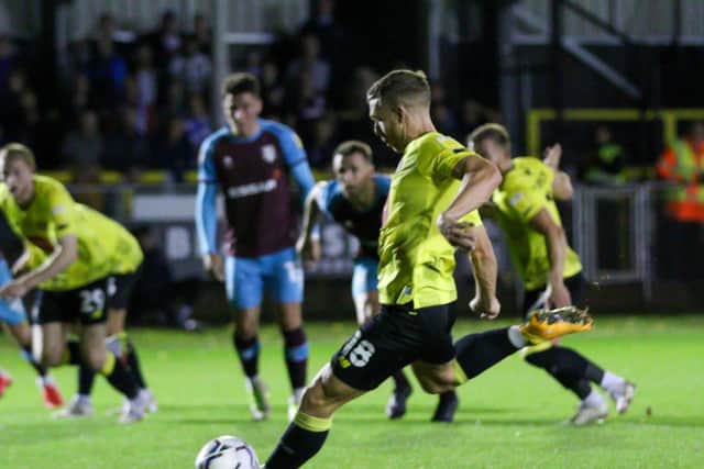 Jack Muldoon scores from the penalty spot to get Harrogate Town back on terms with Tranmere Rovers. Picture: Matt Kirkham