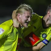 Luke Armstrong, left, is congratulated by Harrogate Town skipper Josh Falkingham after netting his eighth goal of the season during Tuesday's 2-2 draw with Tranmere Rovers. Picture: Matt Kirkham