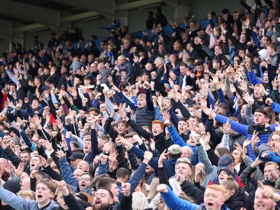 Hartlepool United supporters celebrate Saturday's 3-2 League Two success over Harrogate Town. Pictures: Matt Kirkham