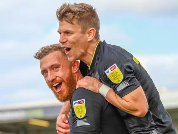 George Thomson is congratulated by Lloyd Kerry after firing Harrogate Town into a first-half lead at Hartlepool United. Picture: Matt Kirkham