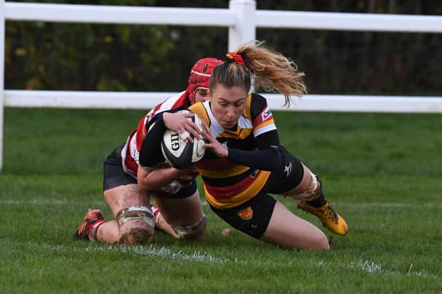 Harrogate RUFC Ladies centre Lauren Bolger dives over to score her first try of the afternoon in Sunday's 49-0 victory over Sefton. Pictures: Gerard Binks