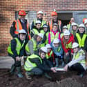 Children and teachers from Woodfield Community Primary School with Mark Smith, Managing Director at The HACS Group; Freddie Hebdon, Project Manager at Brierley Homes; Sam Ellis, Site Manager at The HACS Group and Andrew Brumfitt, Group and Safety Manager at The HACS Group