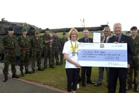 A marathon fundraiser for the RBL.  Left to right with the cheque are Claire Crabb, Royal British Legion Branch Chairman Gordon Townsley, Royal British Legion Field Officer Colin Northridge, Poppy Appeal Organiser David Marshall and Peninsula Company OC Lawrence Crabb.