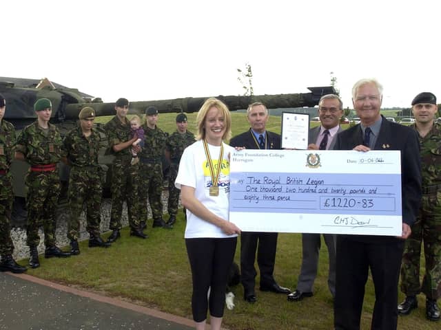 A marathon fundraiser for the RBL.  Left to right with the cheque are Claire Crabb, Royal British Legion Branch Chairman Gordon Townsley, Royal British Legion Field Officer Colin Northridge, Poppy Appeal Organiser David Marshall and Peninsula Company OC Lawrence Crabb.