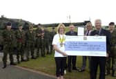 A marathon fundraiser for the RBL.  Left to right with the cheque are Claire Crabb, Royal British Legion Branch Chairman Gordon Townsley, Royal British Legion Field Officer Colin Northridge, Poppy Appeal Organiser David Marshall and Peninsula Company OC Lawrence Crabb.