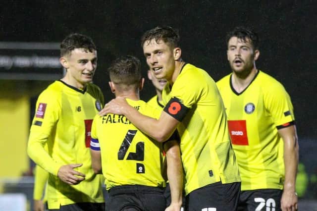 Danilo Orsi celebrates with his Harrogate Town team-mates after netting the winning goal in Saturday's FA Cup clash with Wrexham. Pictures: Matt Kirkham
