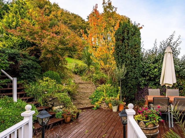 Decked seating areas within the cottage garden.