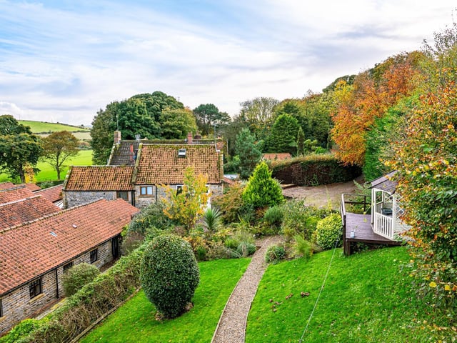 Lovely gardens and countryside surround the cottage/