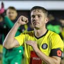 Danilo Orsi celebrates with the Harrogate Town fans following Saturday's FA Cup first round win over Wrexham. Pictures: Matt Kirkham
