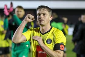 Danilo Orsi celebrates with the Harrogate Town fans following Saturday's FA Cup first round win over Wrexham. Pictures: Matt Kirkham