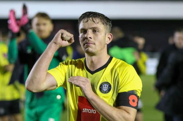 Danilo Orsi celebrates with the Harrogate Town fans following Saturday's FA Cup first round win over Wrexham. Pictures: Matt Kirkham