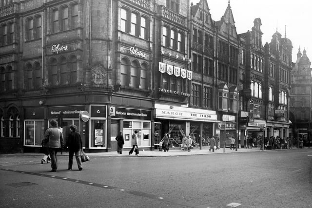 Vicar Lane showing the junction with Sidney Street on the left in January 1980. Shops include National Westminster Bank, March the Tailor, Photomarket and Bargin Records.